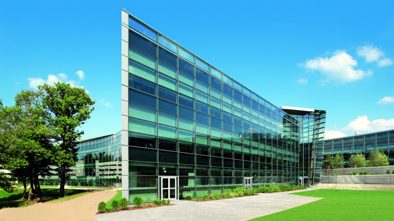 modern office exterior with Schuco aluminium curtain walls with mullions and transoms and reflective glass for residential, public and hospitality buildings