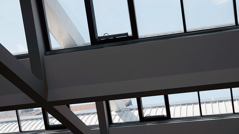 Grey Aluminium Skylights with motorized frames for the renovation of an industrial building