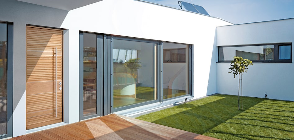 armoured entrance doors installed in a modern house with machined wooden panel