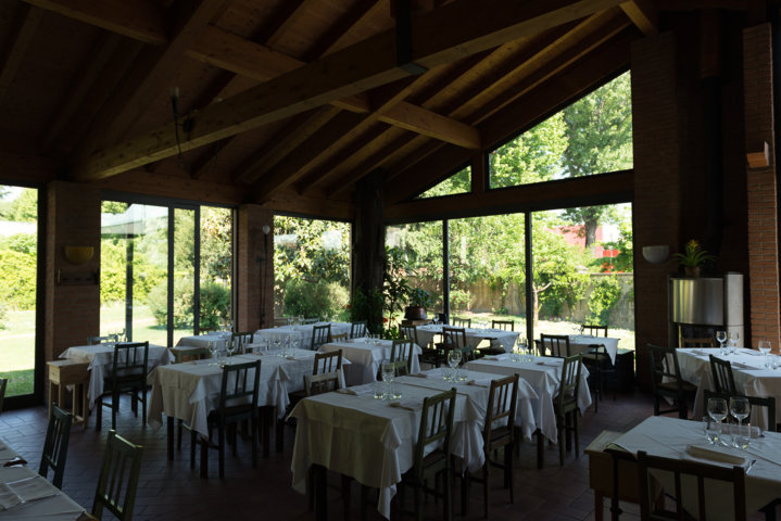 interior of the corner restaurant in vittuone where you can see the schuco sliding doors and windows